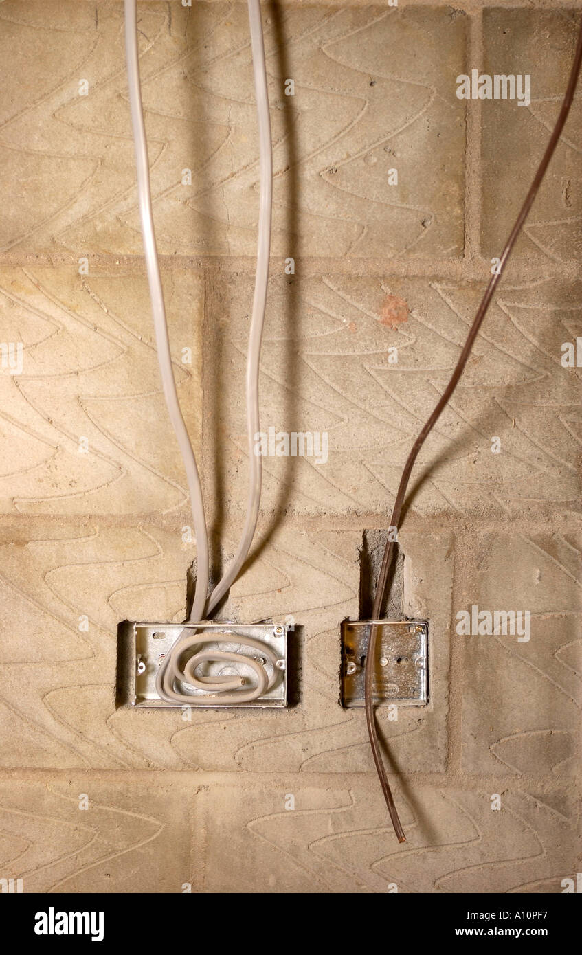 ELECTRICITY AND TELEVISION AERIAL FITTINGS BEFORE PLASTERING Stock Photo