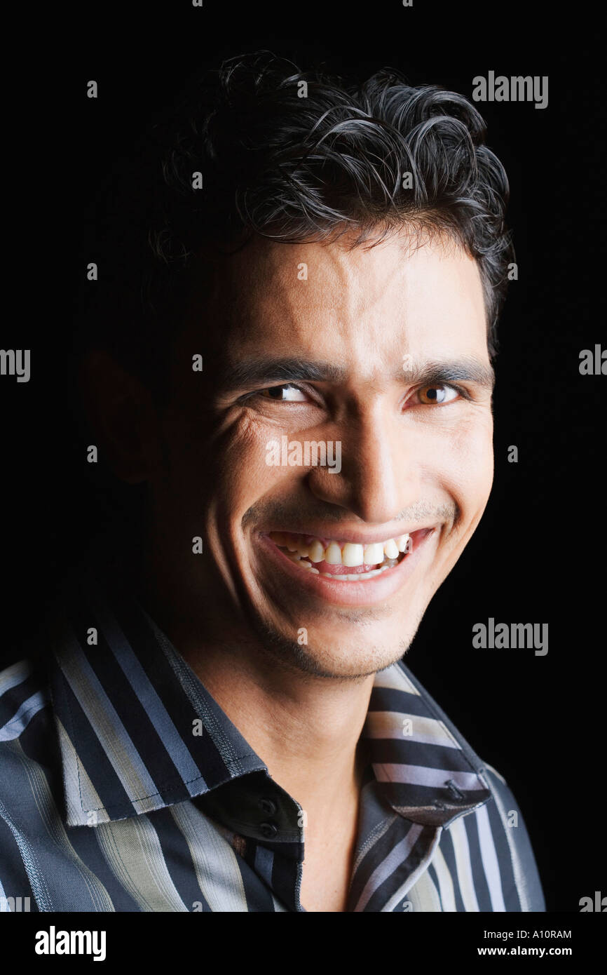 Portrait of a young man smiling Stock Photo - Alamy