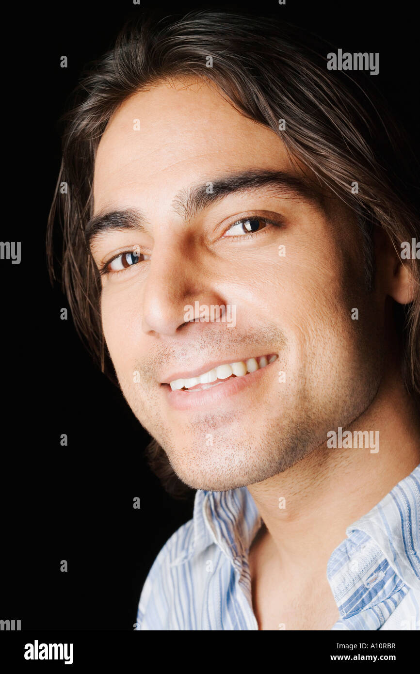 Portrait of a young man smiling Stock Photo - Alamy