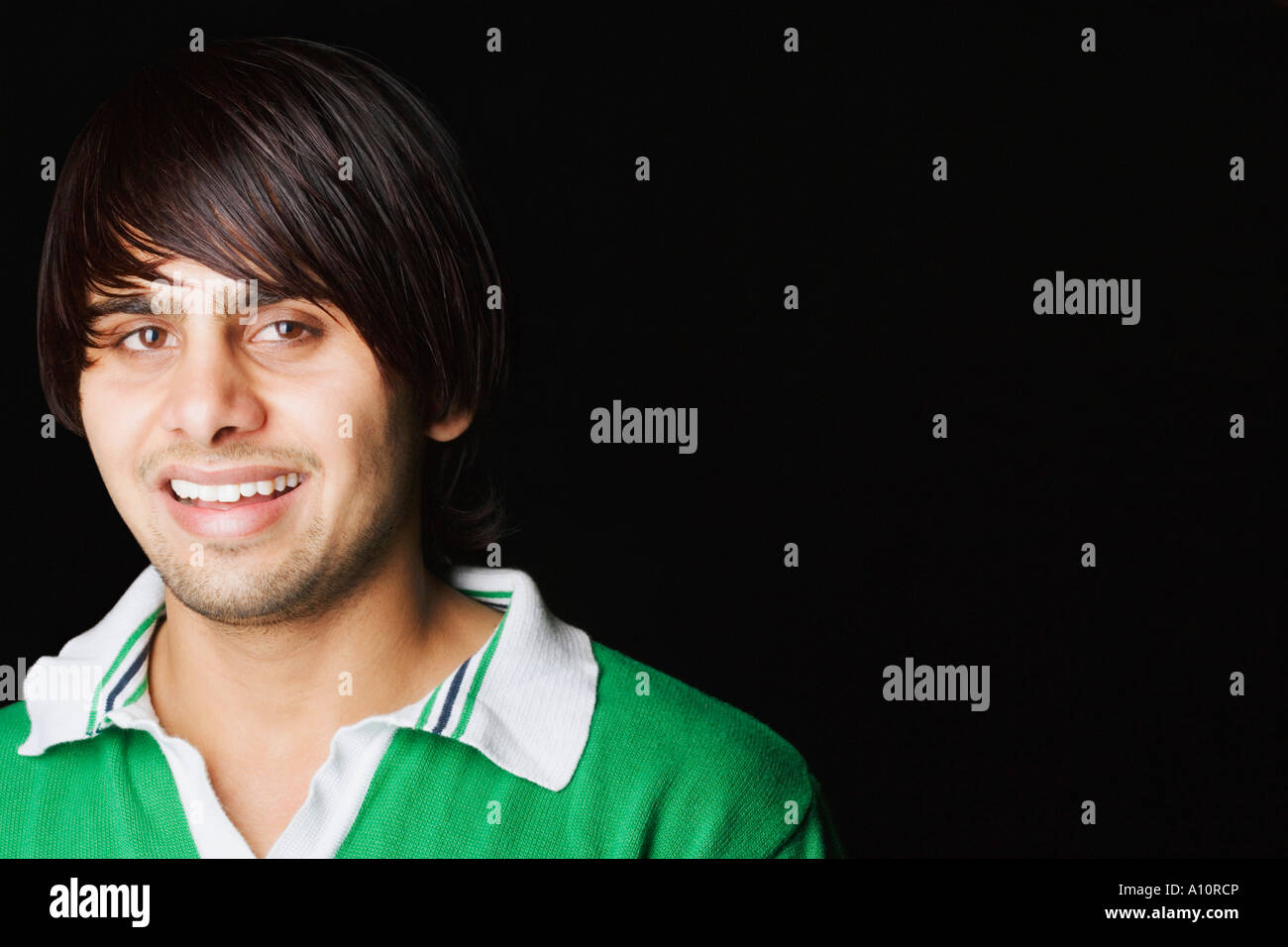 Portrait of a young man smiling Stock Photo - Alamy