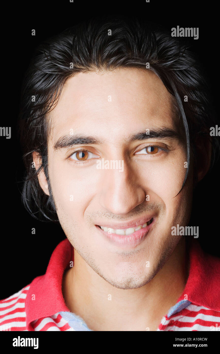 Portrait of a young man smiling Stock Photo - Alamy