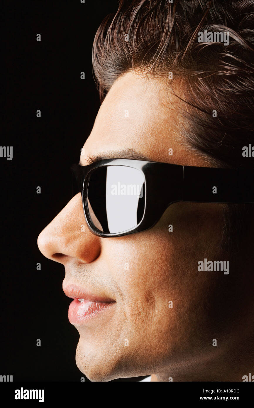 Close-up of a young man wearing sunglasses Stock Photo