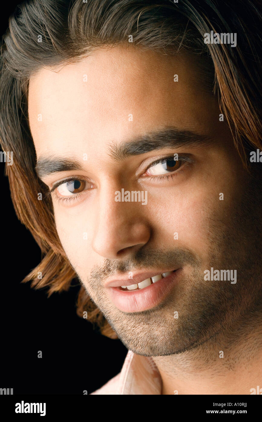 Portrait of a young man smiling Stock Photo - Alamy