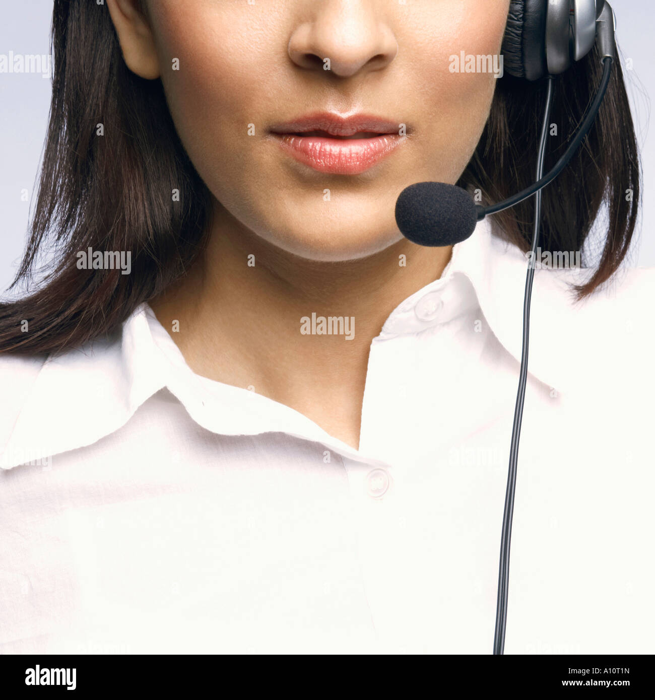 Mid section view of a female customer service representative wearing a ...