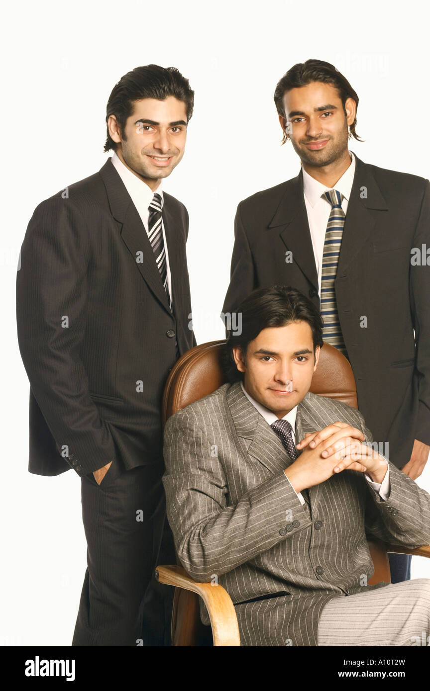 Portrait of three businessmen smiling Stock Photo - Alamy