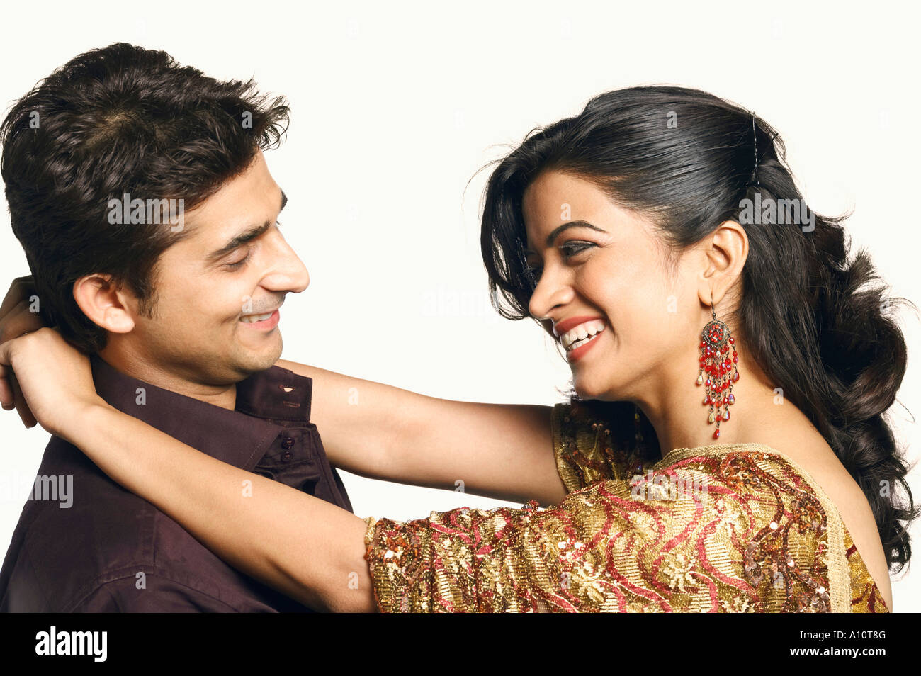 Side profile of a young woman embracing a young man Stock Photo - Alamy