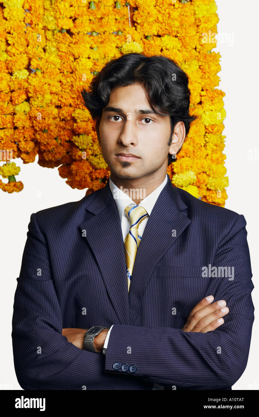 Portrait of a businessman standing with his arms crossed Stock Photo ...