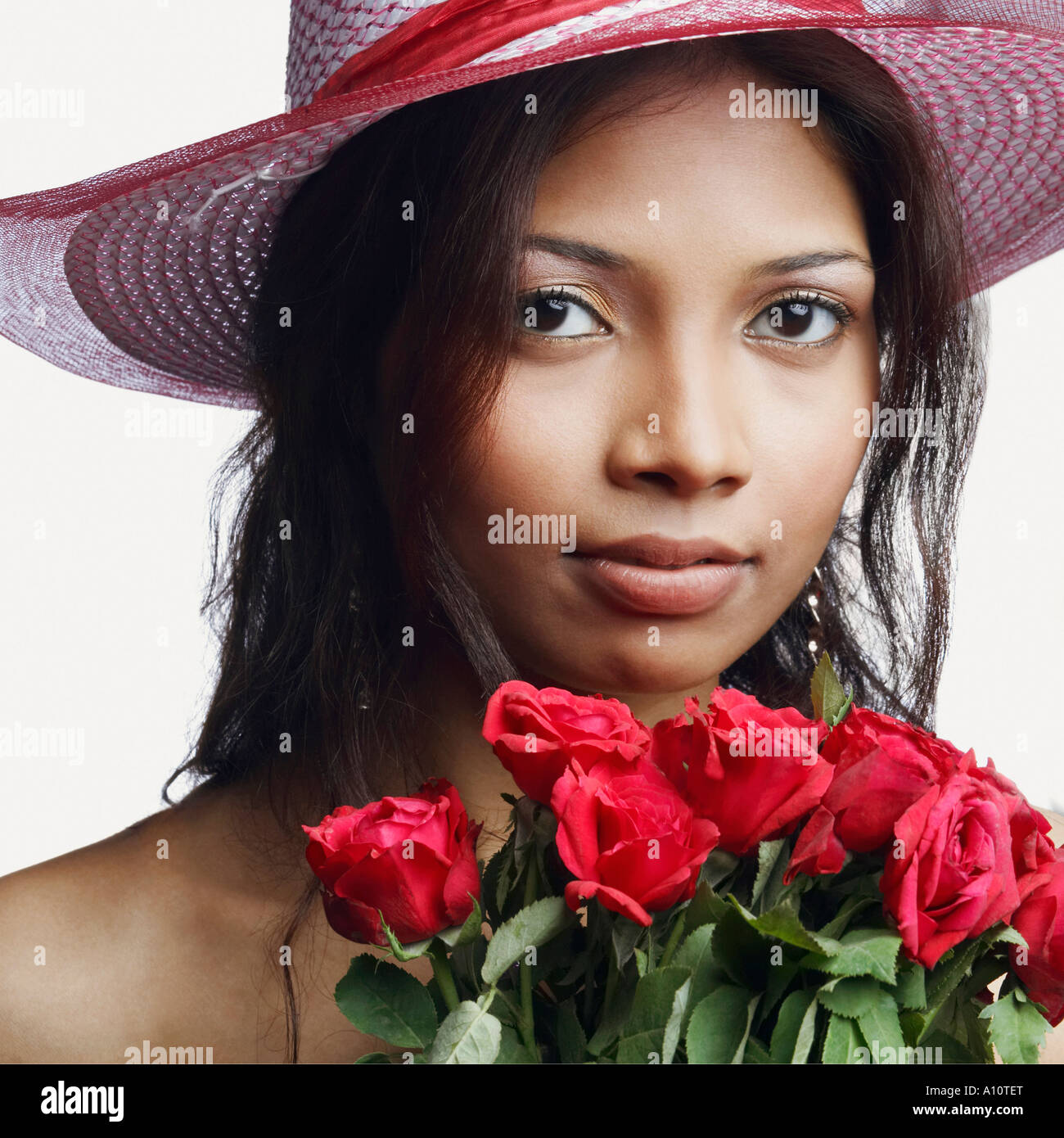 Portrait of a young woman with a bunch of roses Stock Photo - Alamy