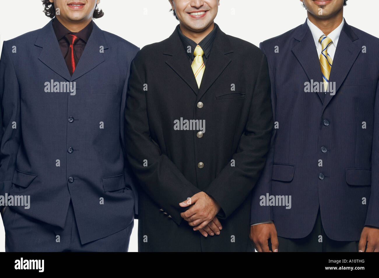 Close-up of three businessmen standing side by side Stock Photo - Alamy