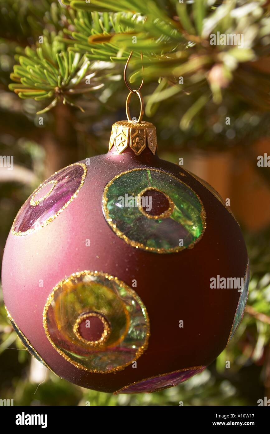 Glass bulb hanging on a christmas tree Stock Photo