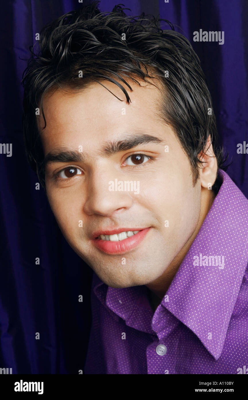 Portrait of a young man smiling Stock Photo - Alamy
