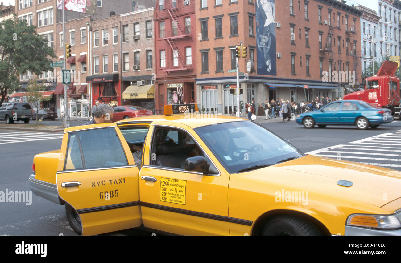 man getting in taxi cab soho new york city Stock Photo
