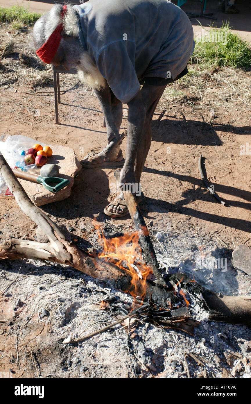 Aboriginal man cooks kangaroo tail Anangu Pitjantjara lands South