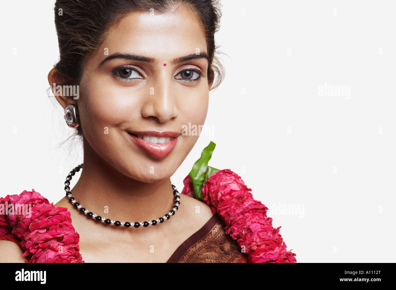 Woman in sari wearing a garland hi-res stock photography and images - Alamy