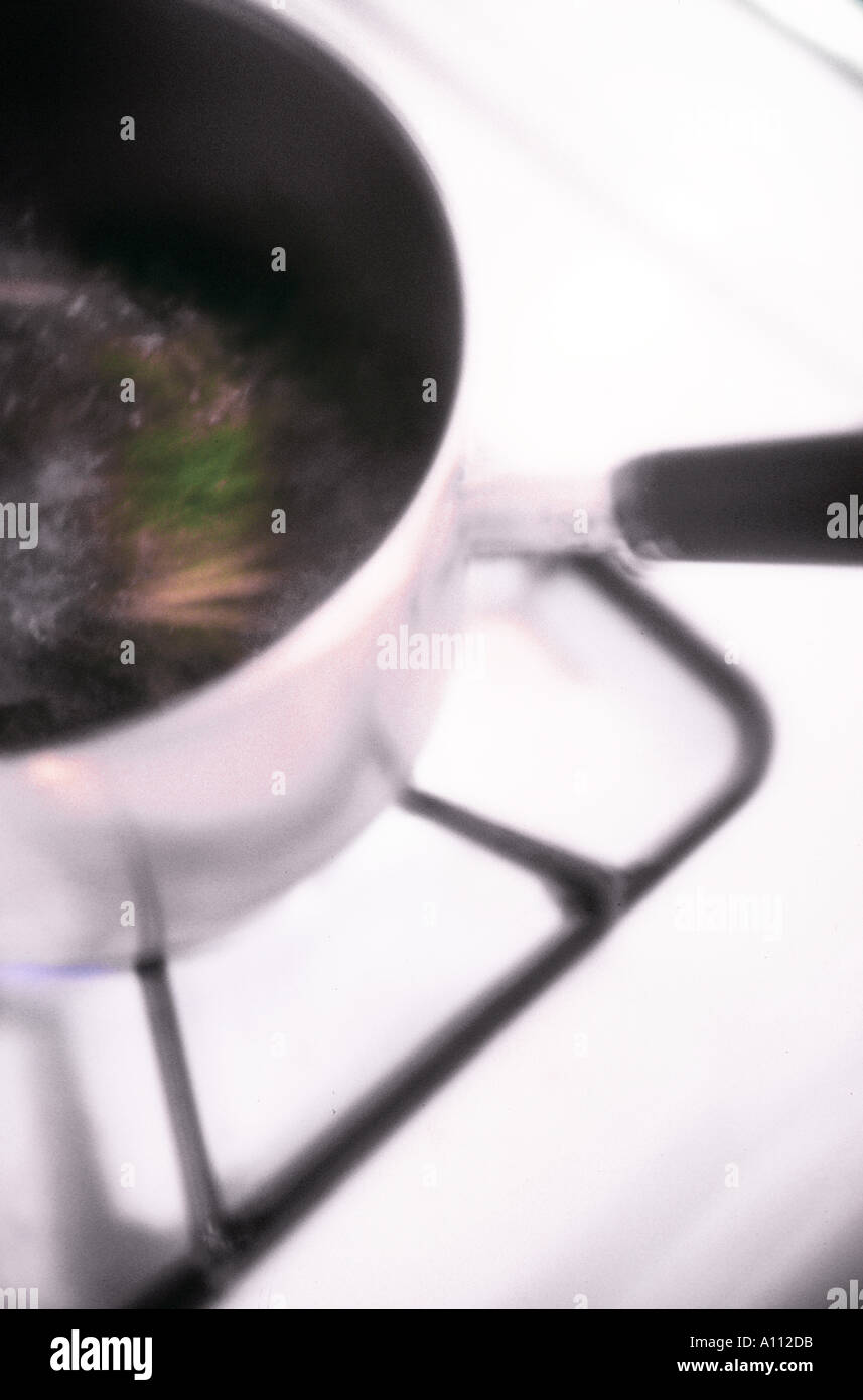 cooking on stove Stock Photo - Alamy
