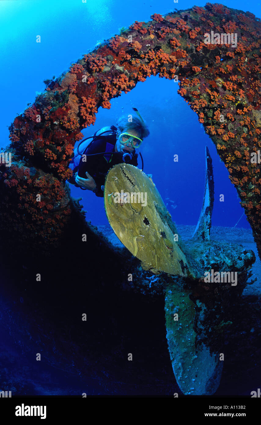 A MALE SCUBA DIVER THE CORAL ENCRUSTED PROPELLER OF THE HILMA HOOKER ...