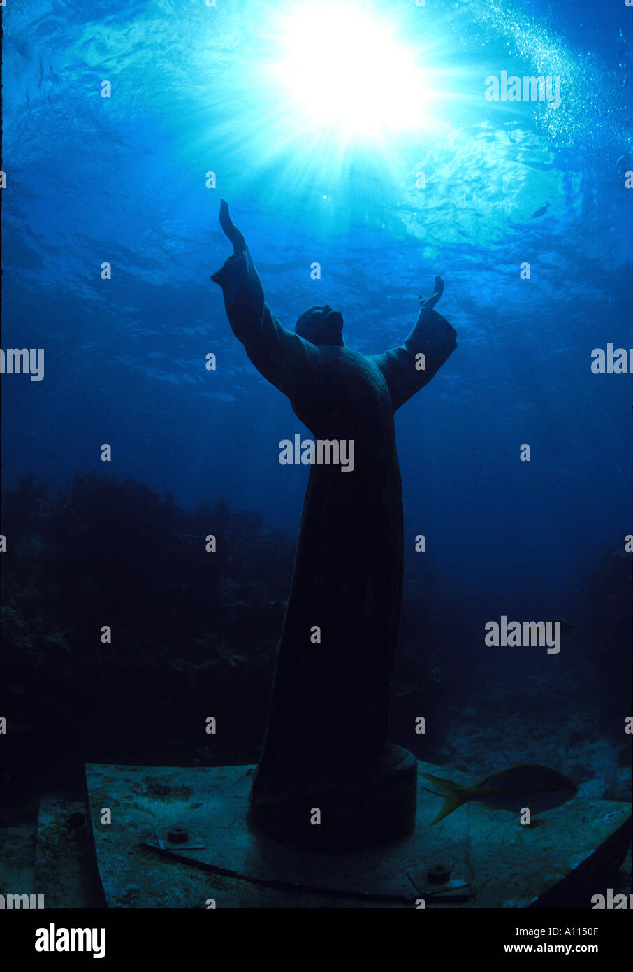 A SILHOUETTE OF THE STATUE OF CHRIST OF THE ABYSS LOCATED ON A REEF IN THE FLORIDA KEYS Stock Photo