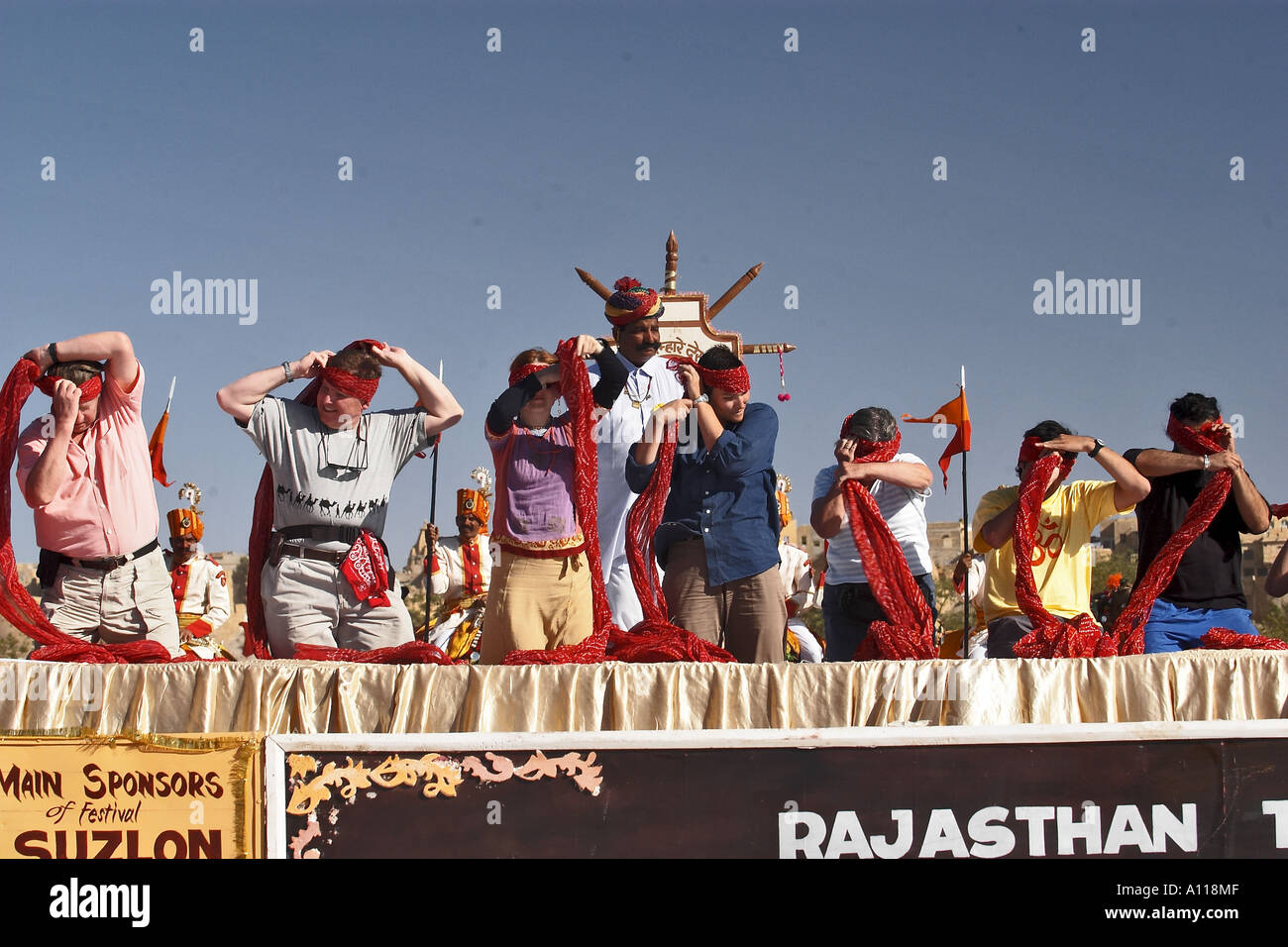 UGA75850 Turban Tying Competition Foreigners Desert Festival 2004 Jaisalmer Rajasthan India Stock Photo