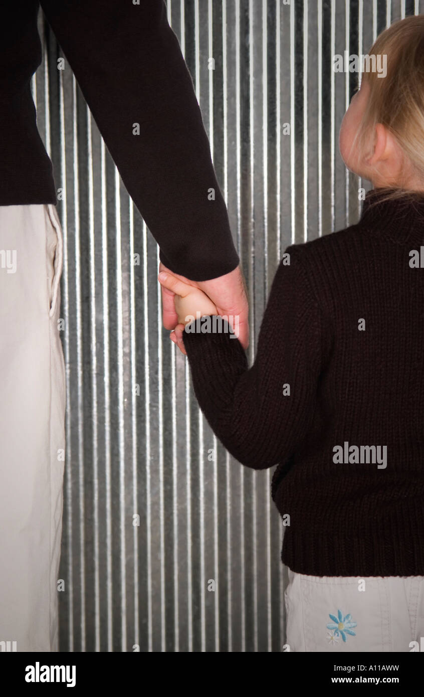Dad and daughter holding hands Stock Photo - Alamy