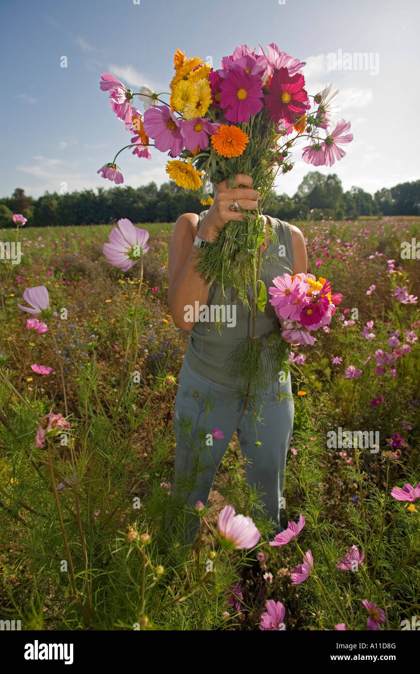 Young Lady Hiding Herself Behind A Bunch Of Flowers France