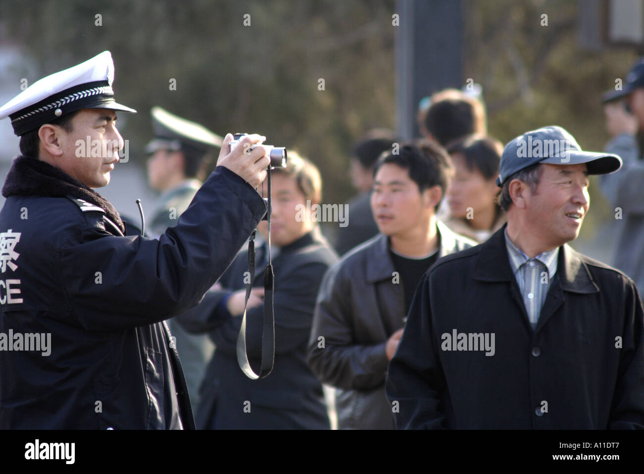 Policeman directs a towtruck behind the Forbidden City, Beijing, China Stock Photo
