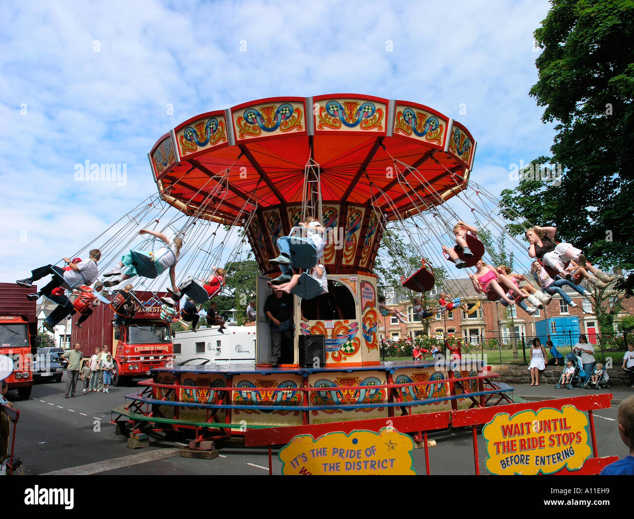 Children riding carousel at Fleetwood Transport Festival 2005 Stock Photo