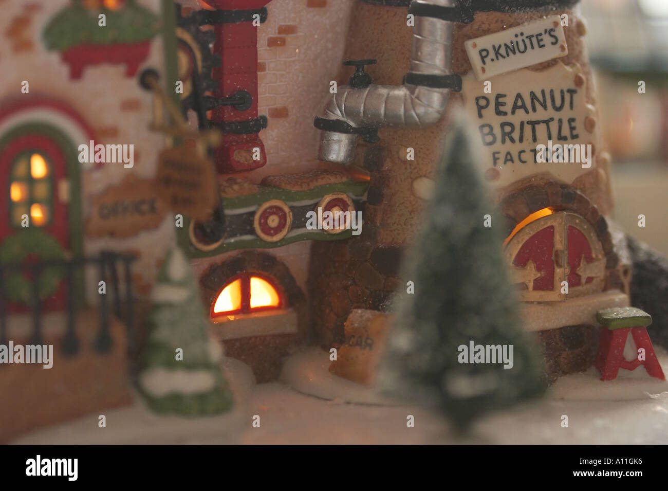 A Christmas village collectible figurine featuring victorian shops