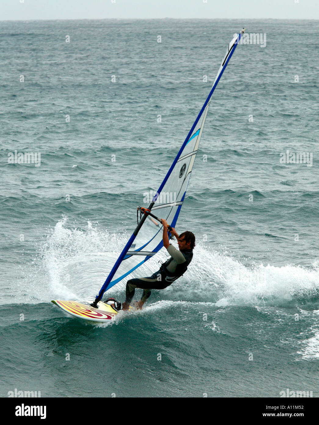 Lone windsurfer surfing at El Medano Tenerife Canary Islands Stock Photo