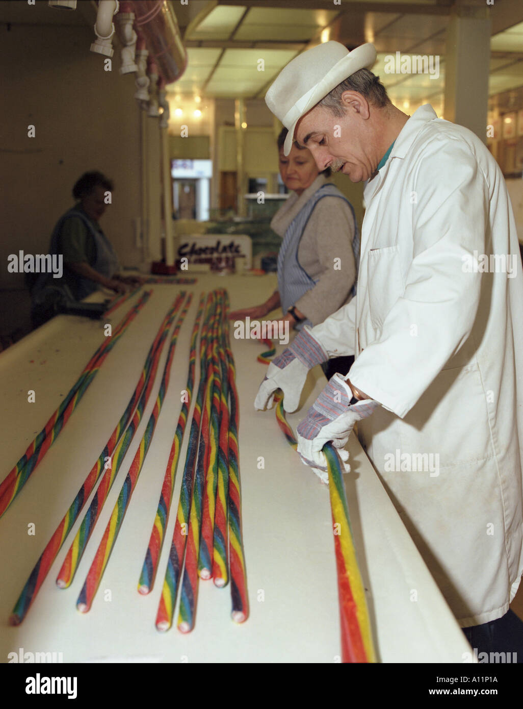 Rock candy maker pulls a batch of lettered rock at Great Yarmouth Stock