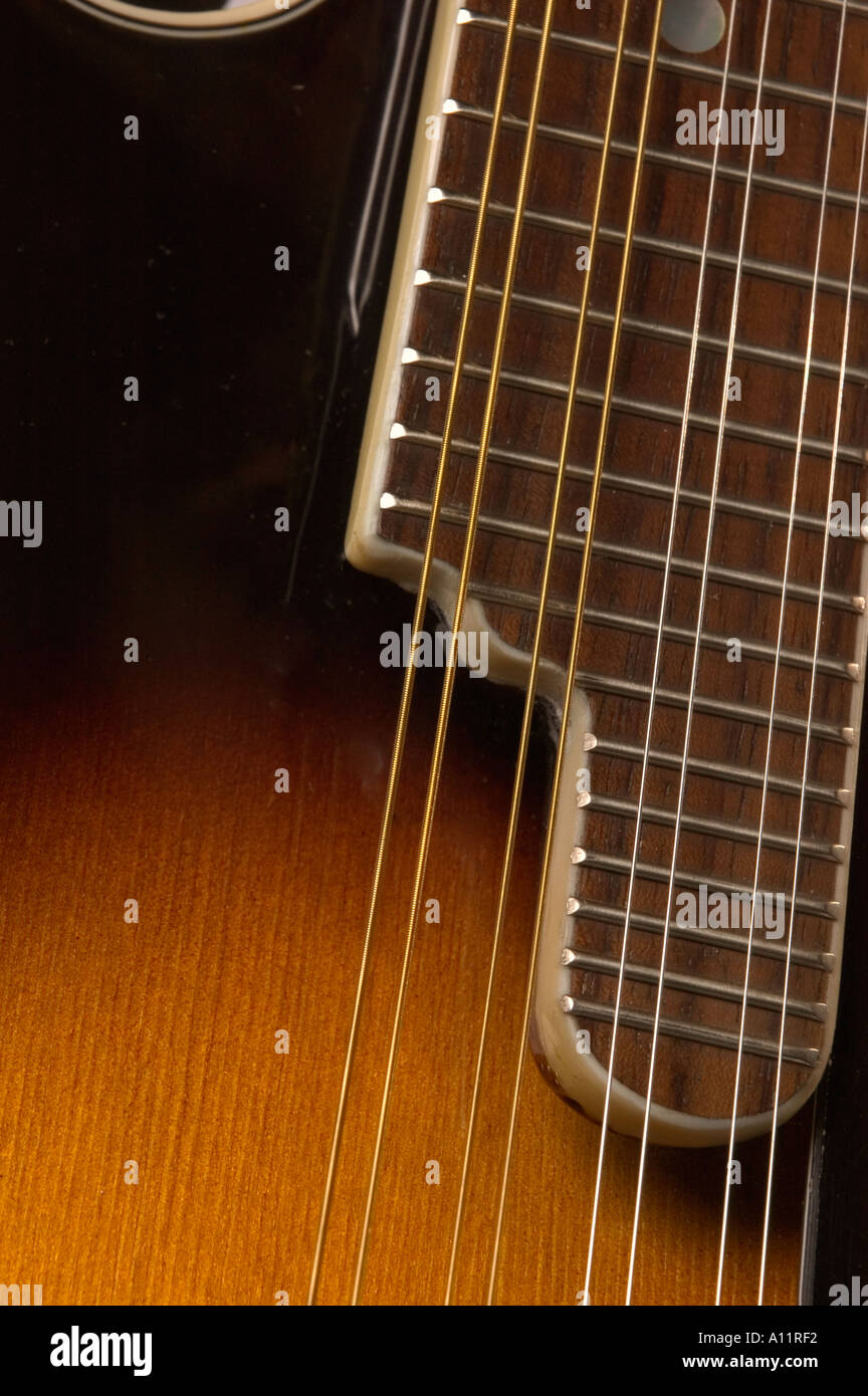 Close up of mandolin fretboard and strings Stock Photo