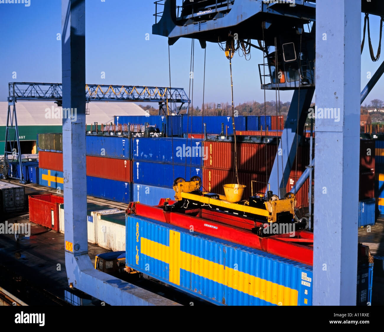 Swedish containers stacked at a container terminal and docks, Sweden imports and exports. Stock Photo