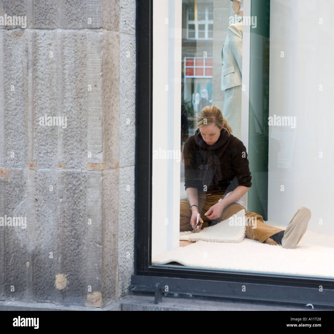 Window Dresser Prepares A Shop Window Dusseldorf Germany Stock