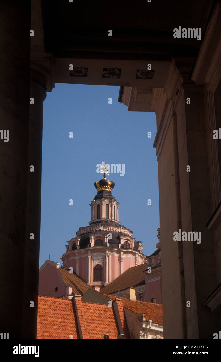 Cathedral of St Casimir viewed through the columns of the Town Hall on Didzioji gatve in Vilnius, Lithuania Stock Photo
