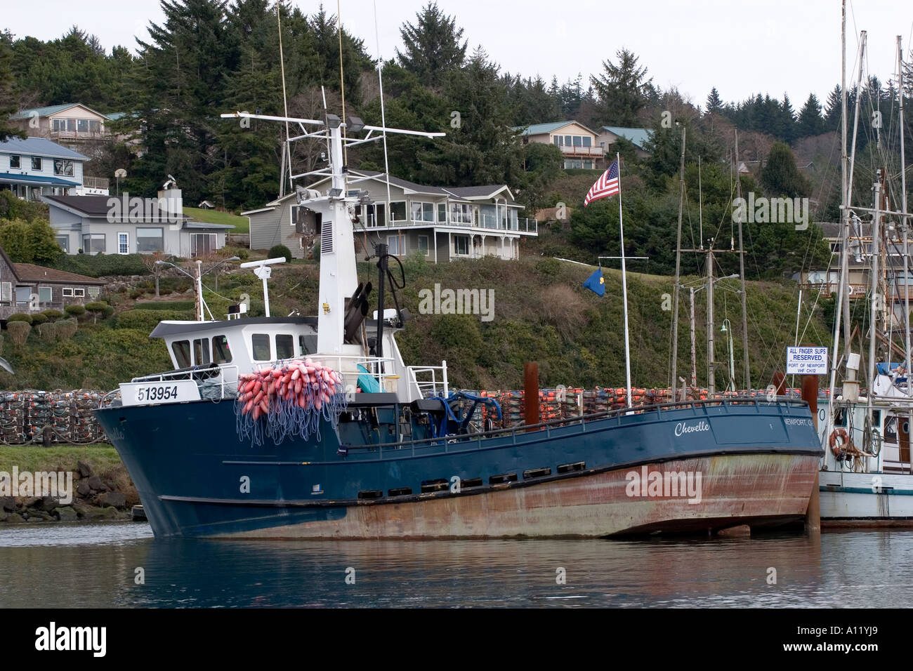 A fishing boat loaded with crab pots awaits the beginning of crabbing