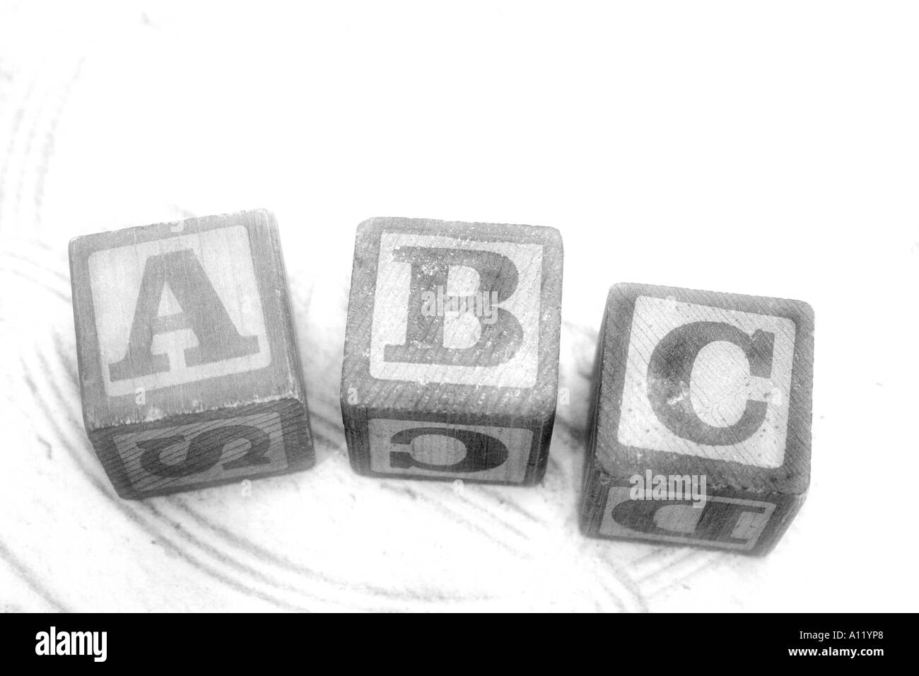 ABC children's blocks on a background of pressed tin Stock Photo
