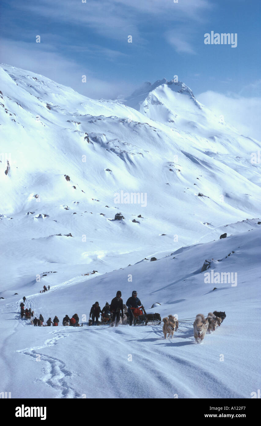 Dog Sledges travelling uphill lightweight flexible sledges are used for travel in mountains Íkáteq East Greenland Stock Photo