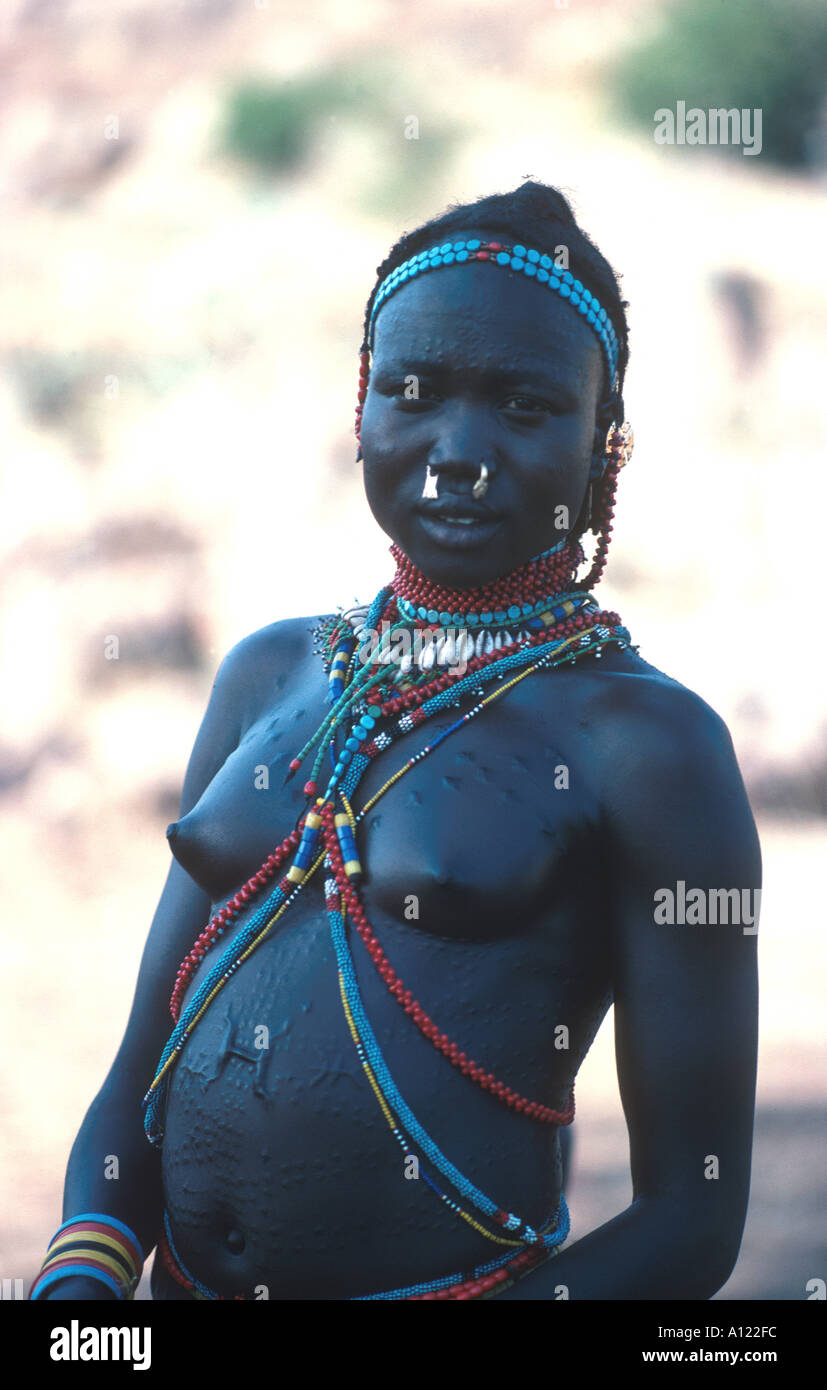 Girl of the Nuba Tribe with elaborate cicatrization scarring Stock Photo