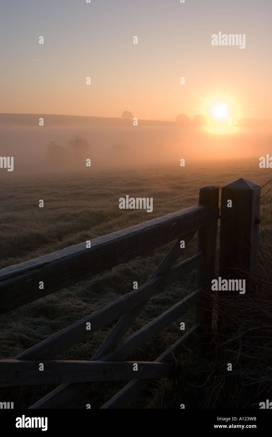 Mist rolling across the landscape early in the morning near Avebury Wiltshire Stock Photo