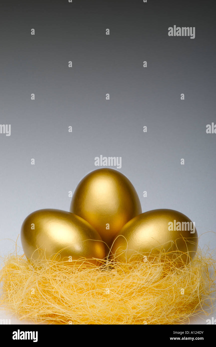 Golden eggs in a nest Stock Photo - Alamy