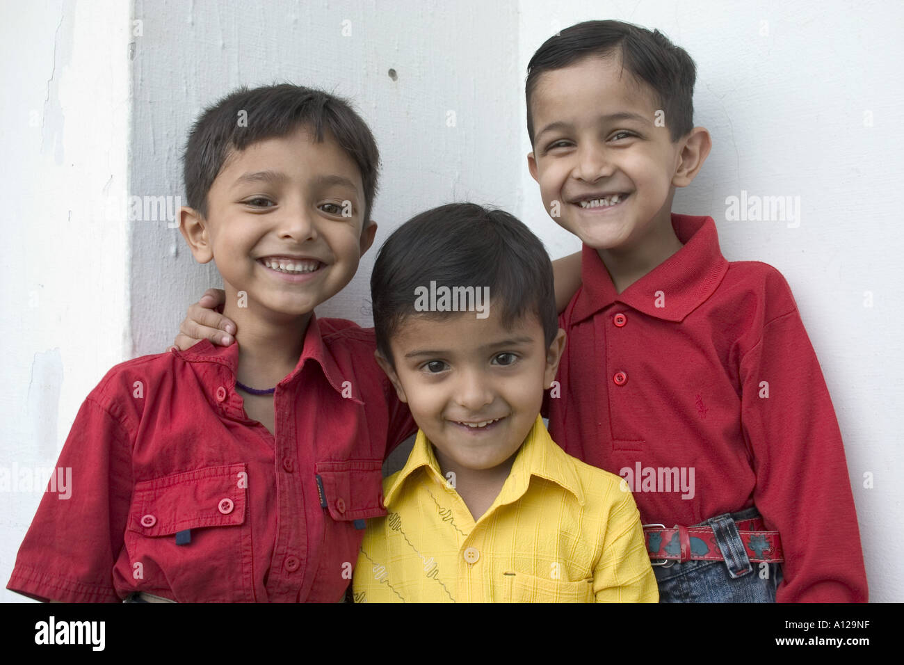 Three Indian Boys smiling laughing playing enjoying Dehradun Uttranchal India Model released No 542 Stock Photo