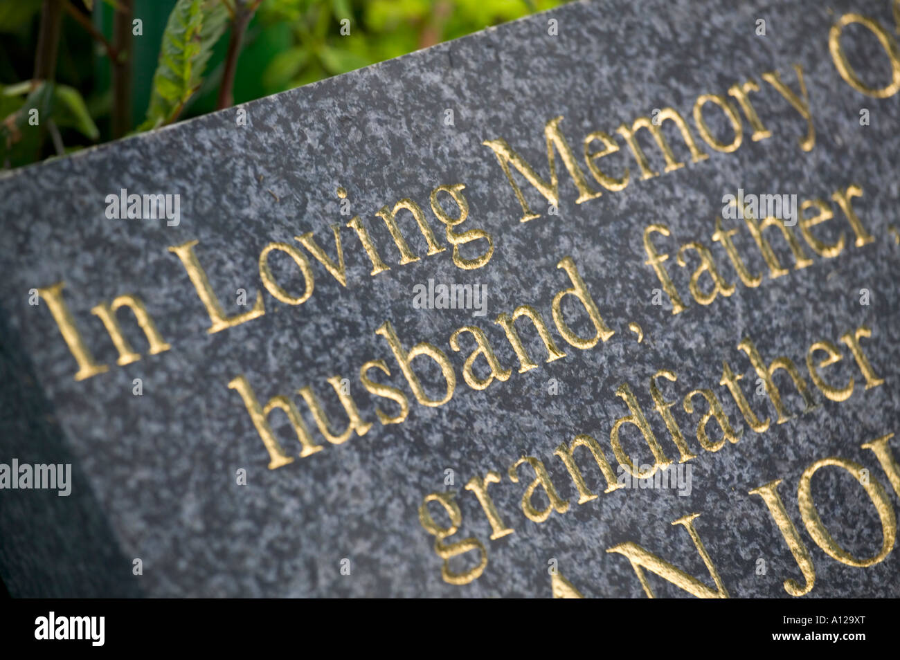 Headstone husband father grandfather Stock Photo Alamy