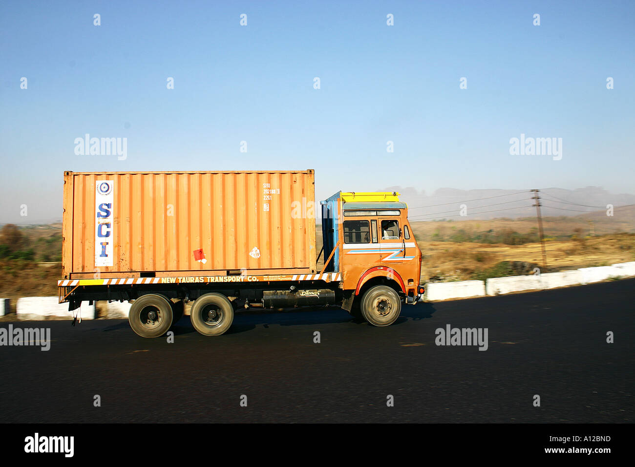 transportation container truck on road, India Stock Photo