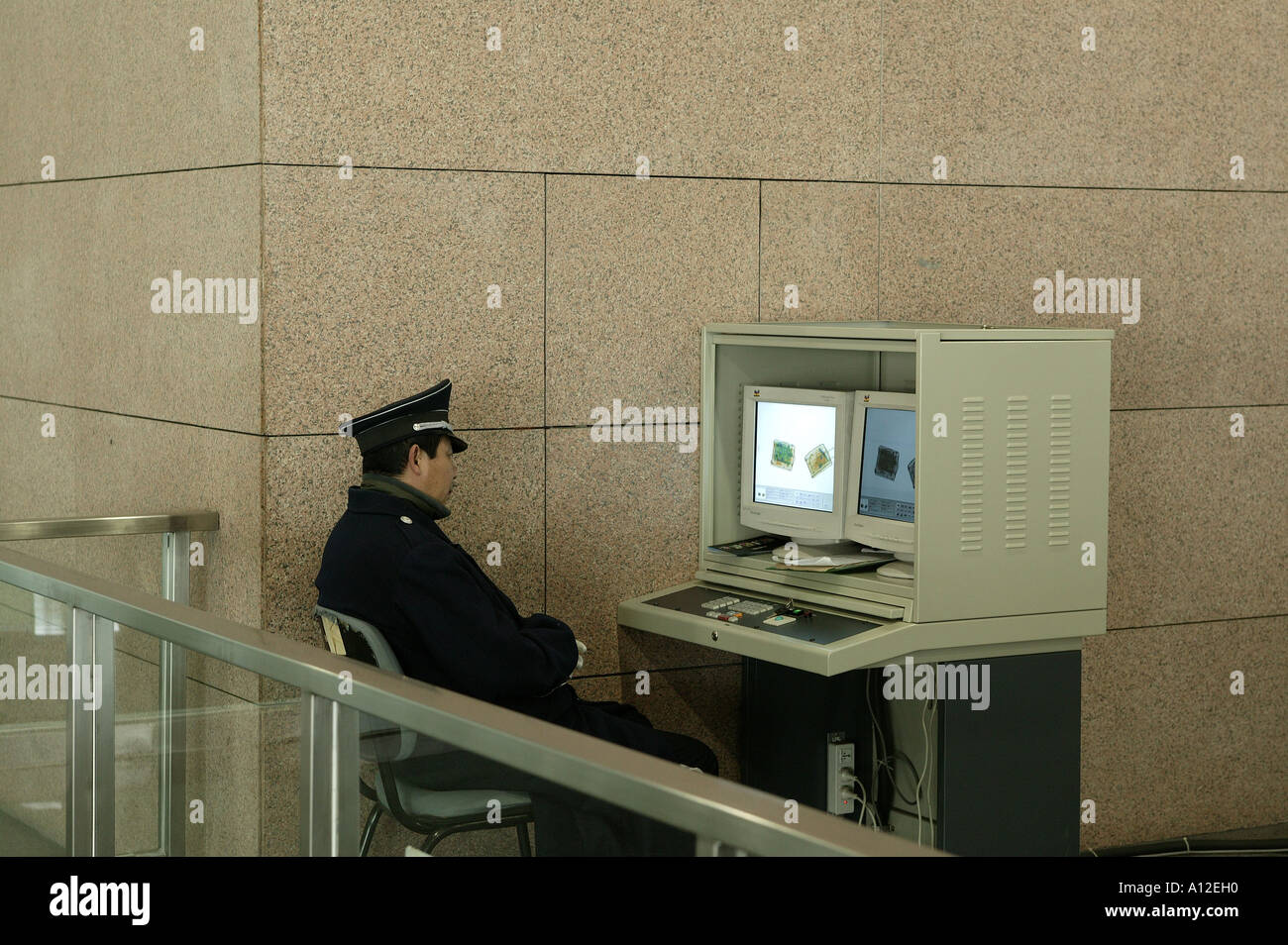 Airport security checking xrayed baggage in China Stock Photo Alamy