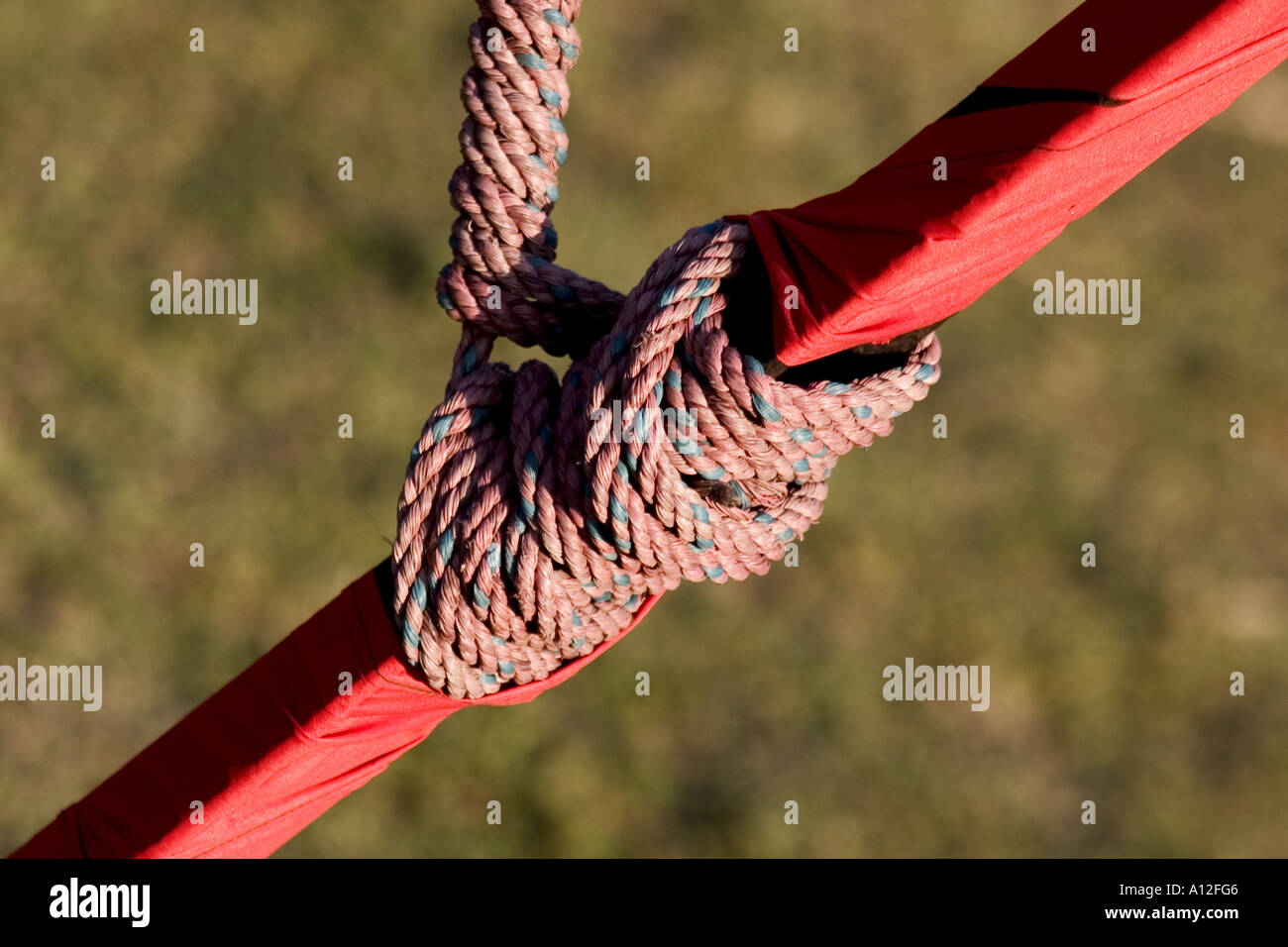 Rope tied to red iron pole in Dehradun, uttarakhand, India, asia Stock Photo
