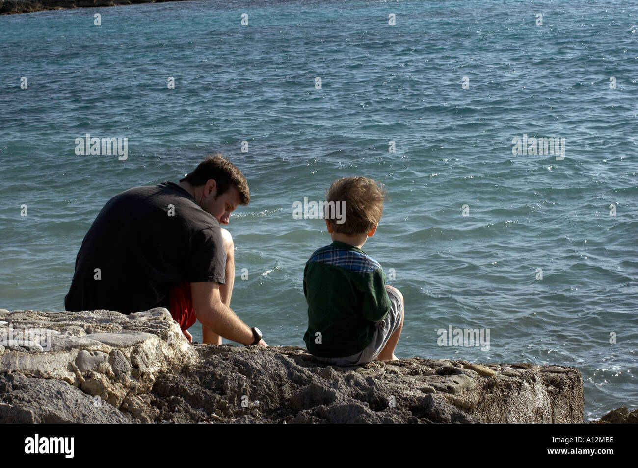 Boy and father at beach model released beach ecology cancun akumal mexico ecosystem environment environmentalism habitat Stock Photo