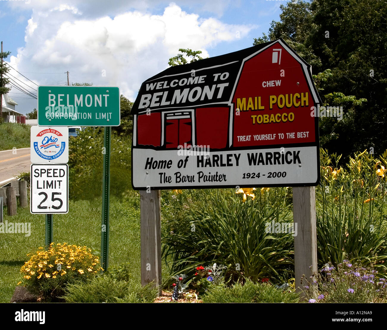 Road sign noting Belmont Ohio as the home of harley Warrick the Mail Pouch Barn painter  Stock Photo