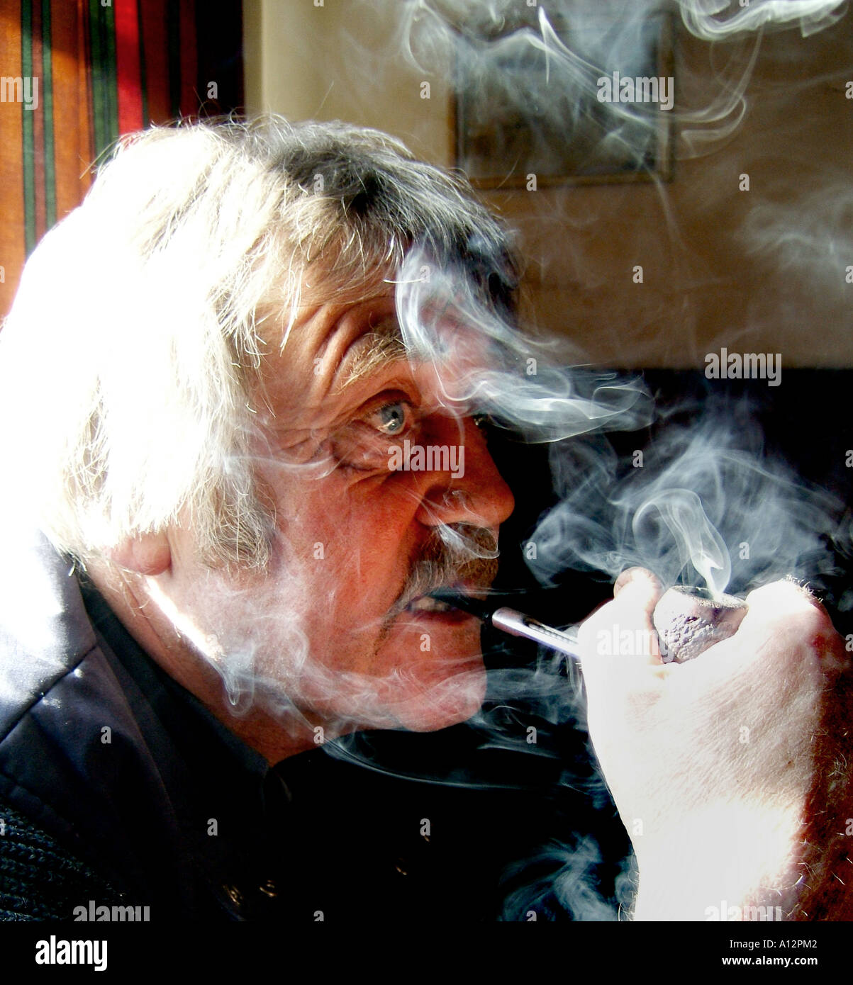 man smoking a pipe Stock Photo