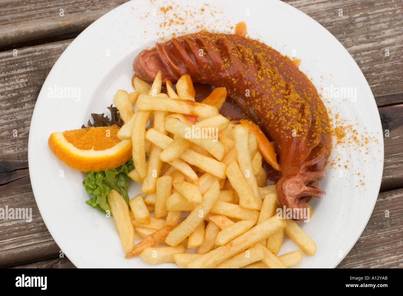 Curry sausage and chips with ketchup Germany Stock Photo Alamy