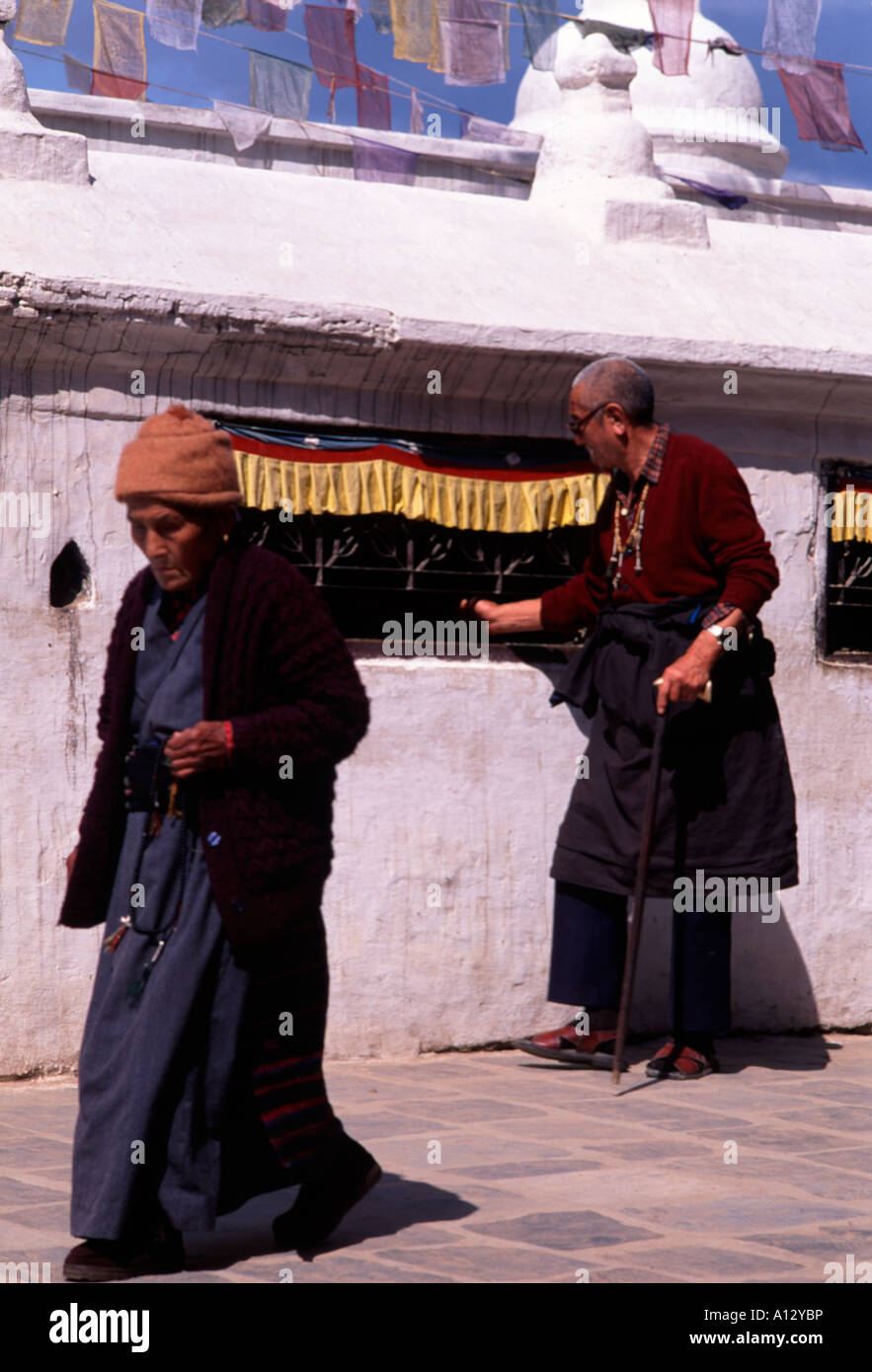 Tibetan buddhists praying and walking round the great stupa in Boudhnanth, Nepal. A site of pilgramage for Buddhists. Stock Photo