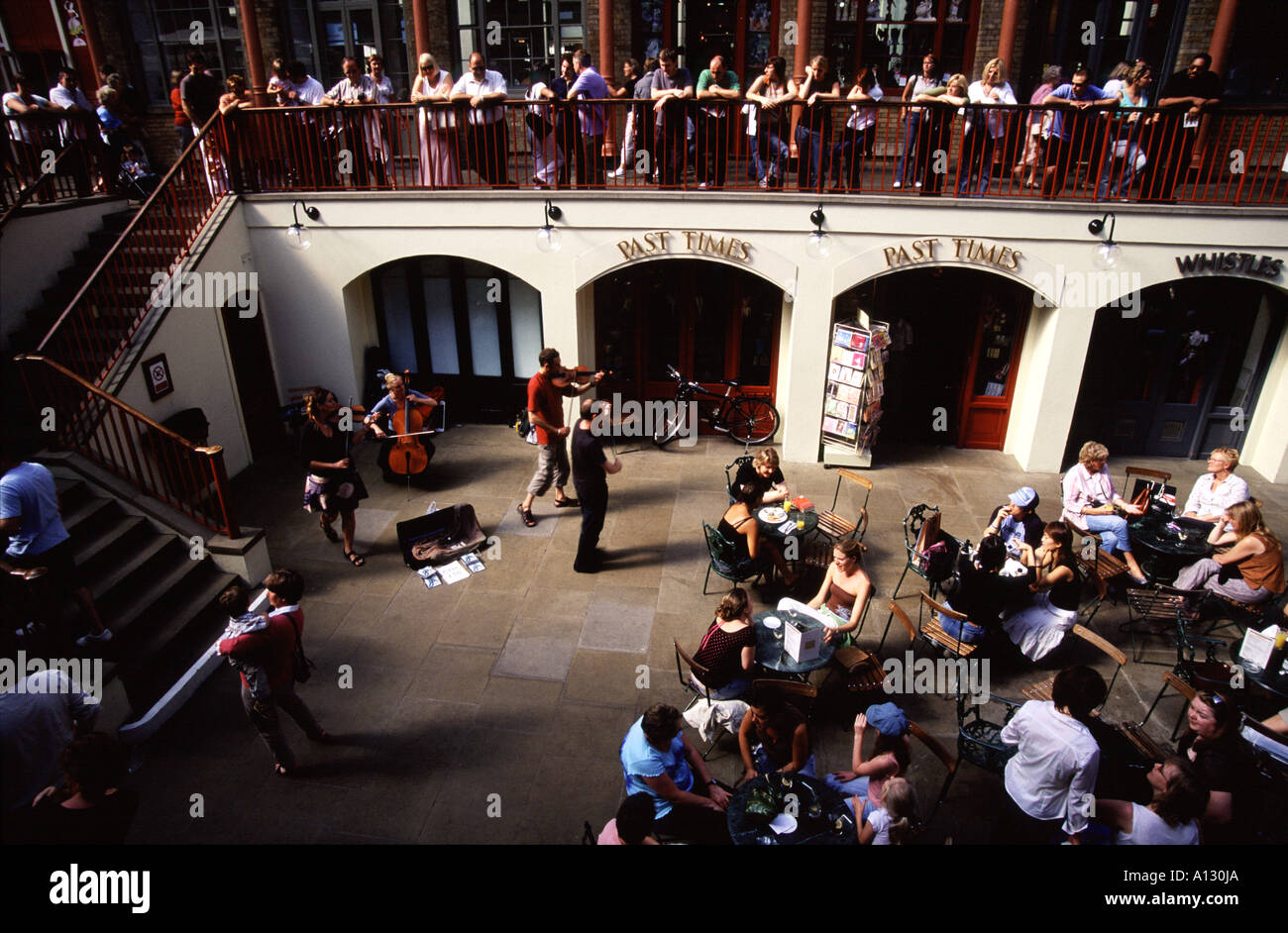 String quartet playing to an audience in an undercover restaurant at